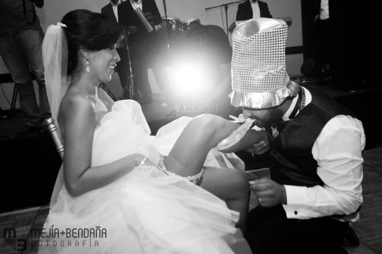 a black and white po of a couple at their wedding
