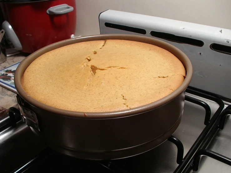 a big cake sitting on top of the stove