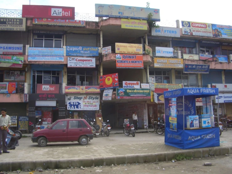 a large building that has several cars parked outside of it