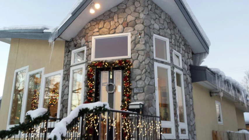 this is the front entrance to a house decorated for christmas