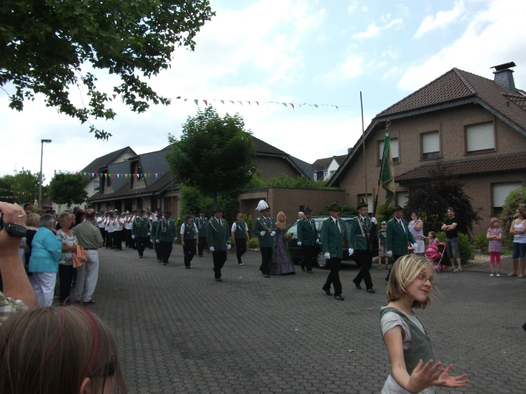 a woman standing in the middle of a street with a band