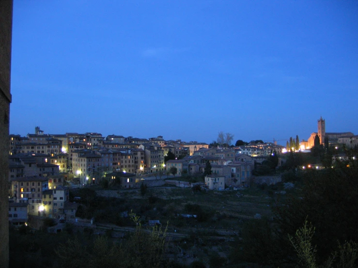 the view of a small city at night from an overlook point