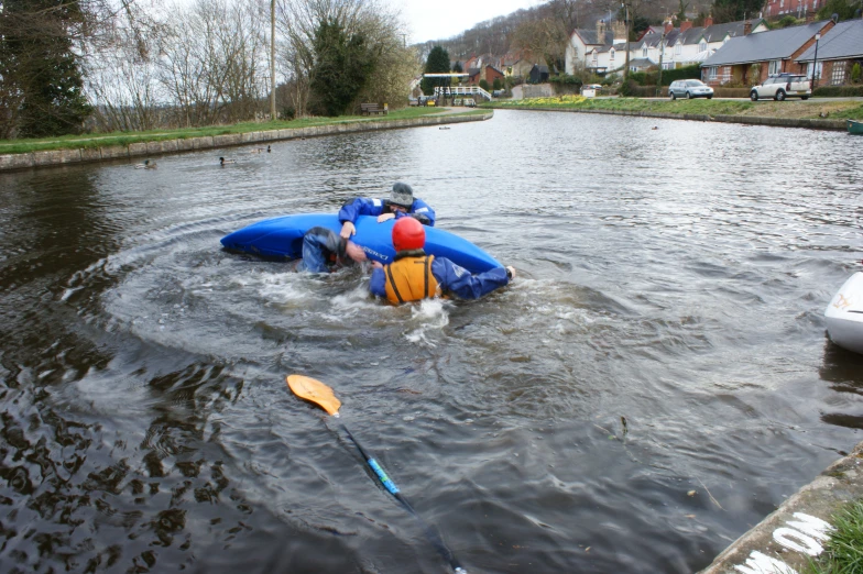 someone on an inflatable boat with oars coming out from the water