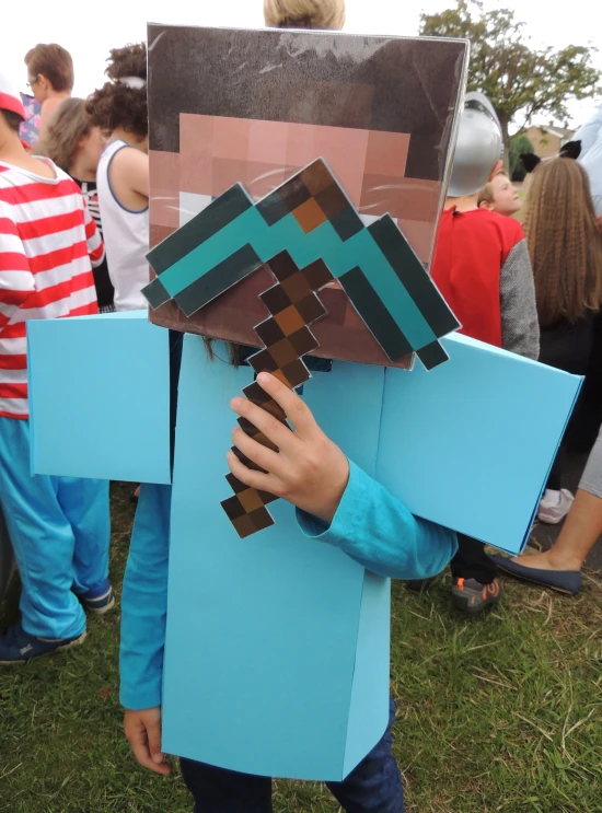 a  holding onto a cardboard block like a minecraft guy