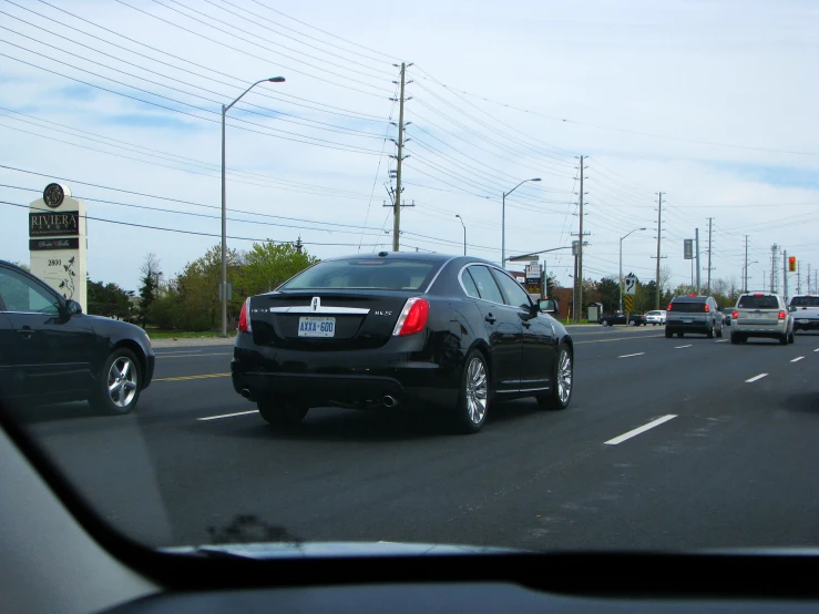 there is a car that is traveling down the street