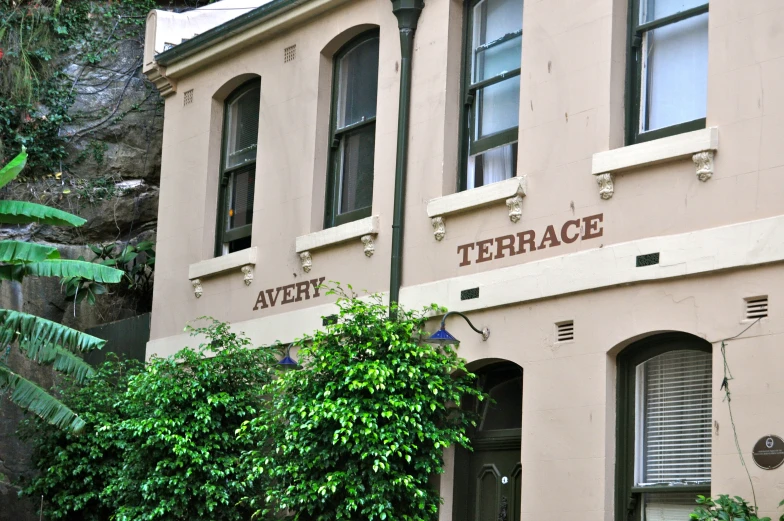 a building with several small windows and a name on it