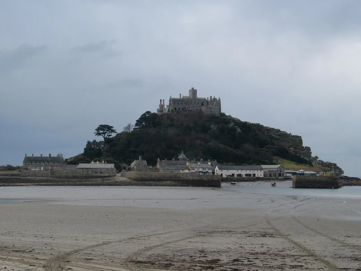 a castle atop an island in the ocean