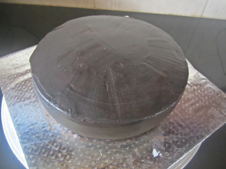 an image of an chocolate cake on foil