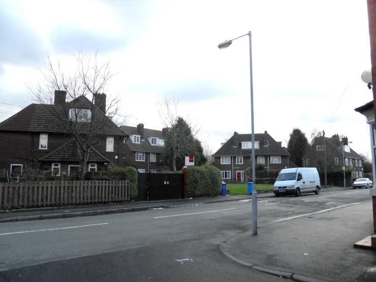 a view of houses from a street corner