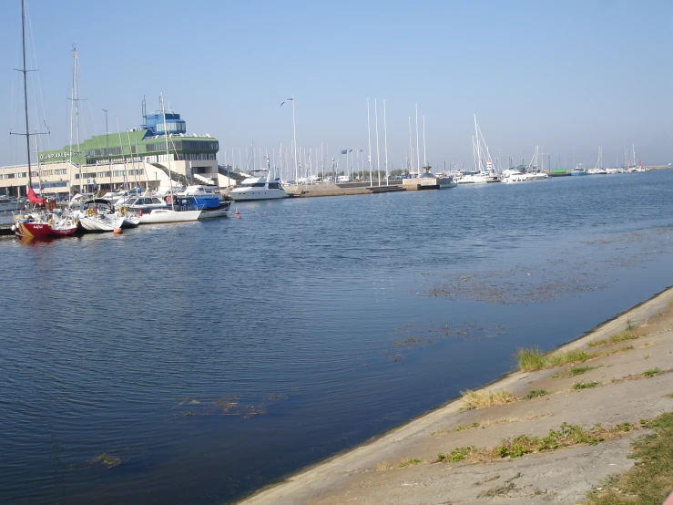 a long waterway with some docked boats on it