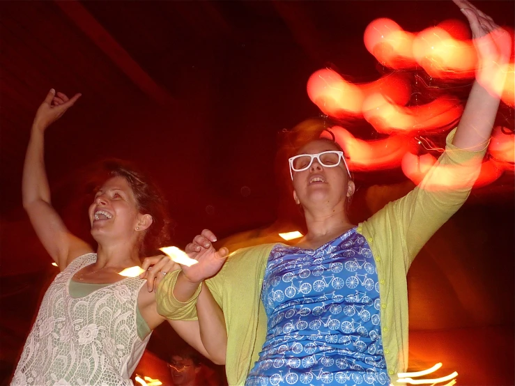 a couple of people dance together on a night stage