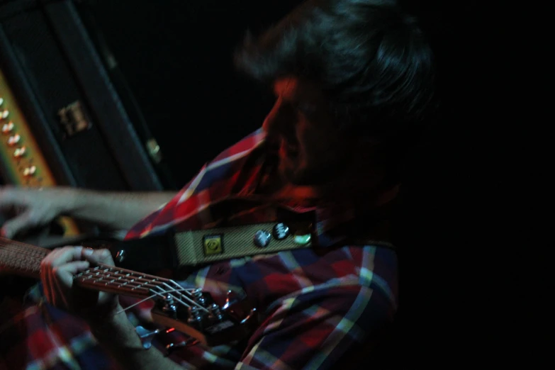 a man with his guitar at a music festival