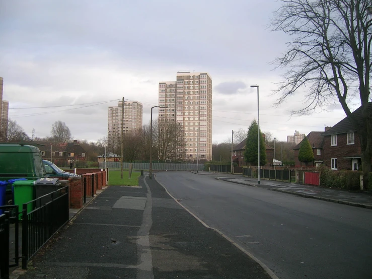 a street lined with tall buildings in a city