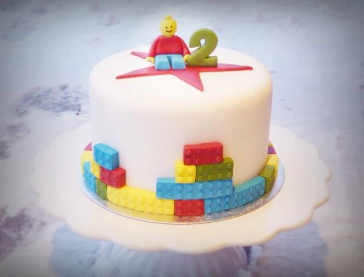 a cake with a lego figure on top