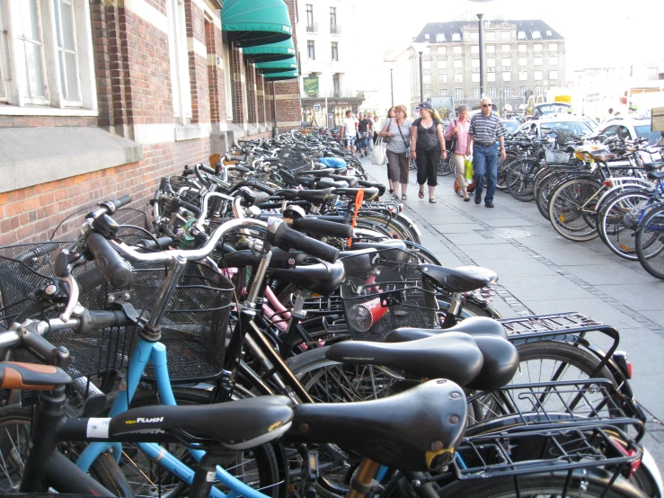 several rows of bicycles parked next to each other