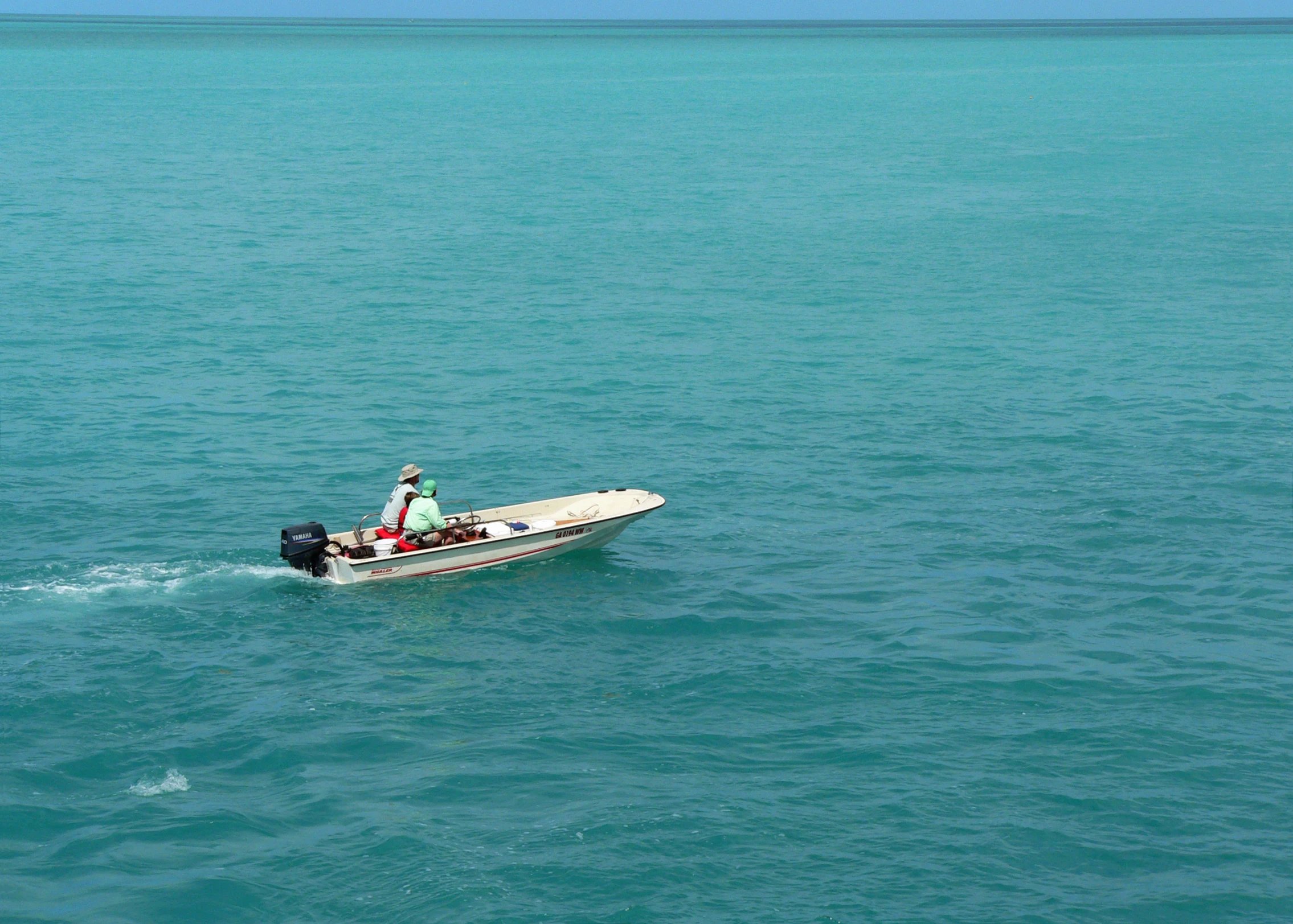 people in the water on a speed boat with a man