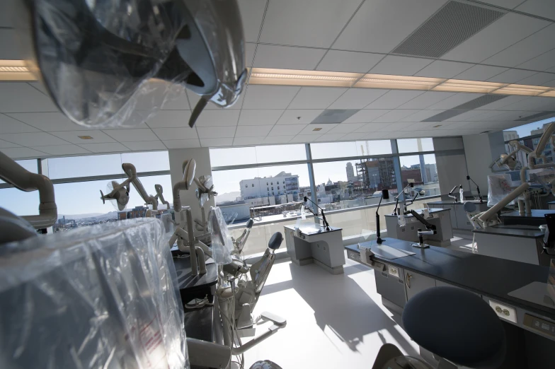 a room with chairs and surgical equipment in it