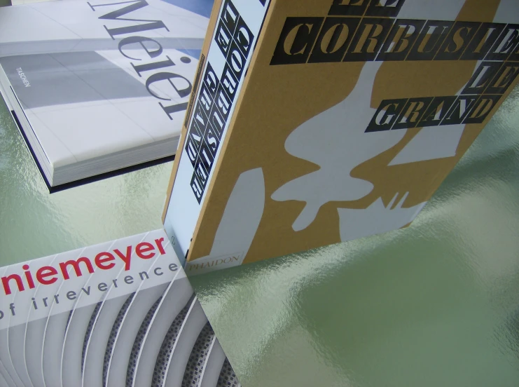 several books sit on a table together on top of each other