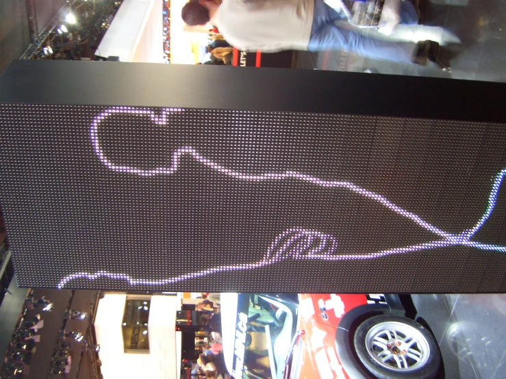 an electronic screen with car pictures on it