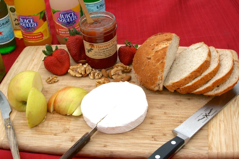 a  board filled with bread and apples