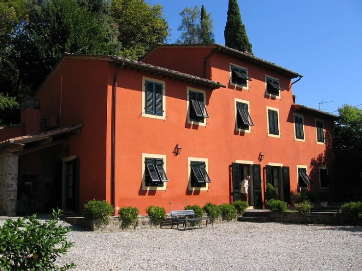 an orange house with a brick roof