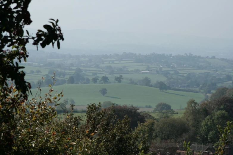 a view of green fields in the distance