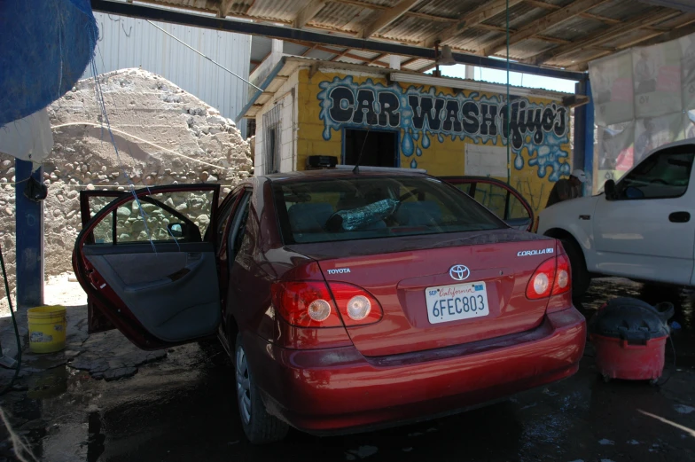 there are many cars parked together at the station