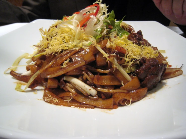 this is a plate of noodles that includes vegetables