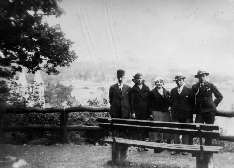 the old picture shows men in hats and suits posing