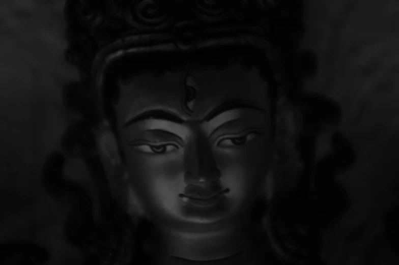 black and white po of a buddha statue