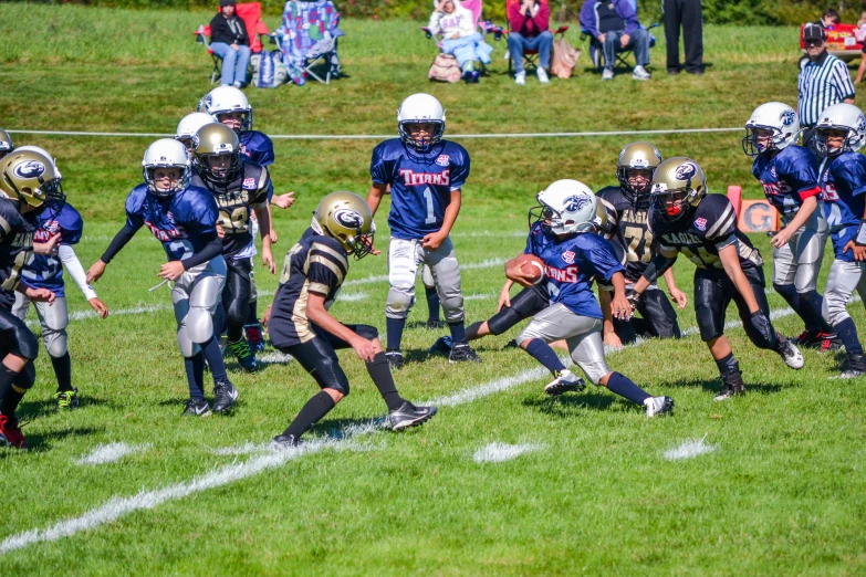 a group of boys playing football against each other