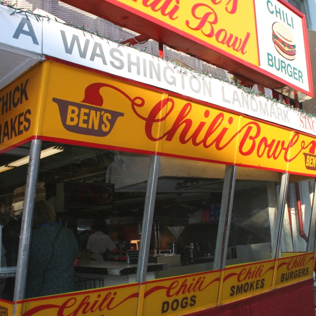 several signs advertising various types of food at a restaurant