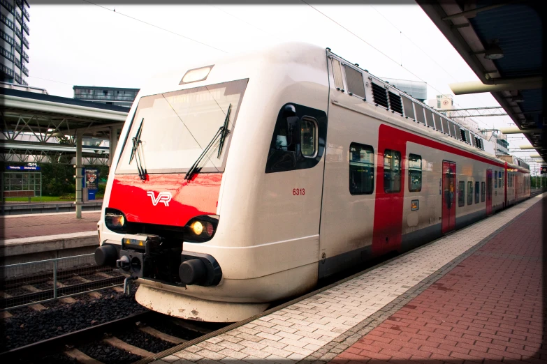 a modern passenger train stopped at a station