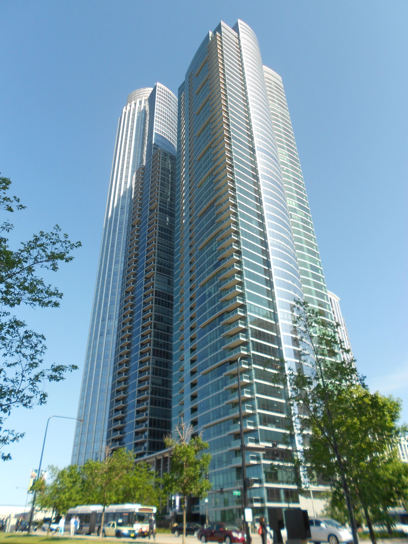 very large buildings sitting next to each other in a park