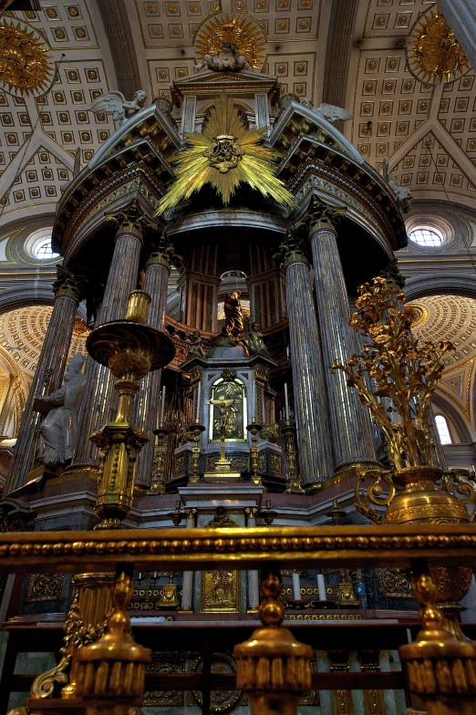 a large cathedral with ornate gold decorations and chandeliers