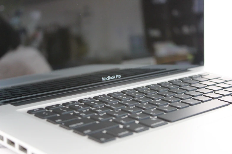 a close up of the keyboard and side of a laptop