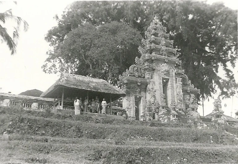 a group of people in a stone pavilion