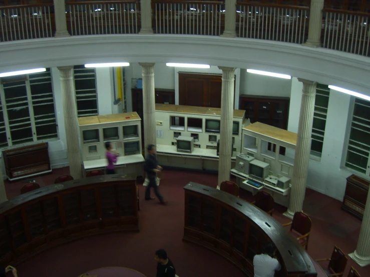 people inside a museum with many electronic equipment