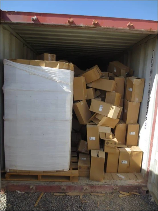 a full storage area with boxes stacked and folded in one