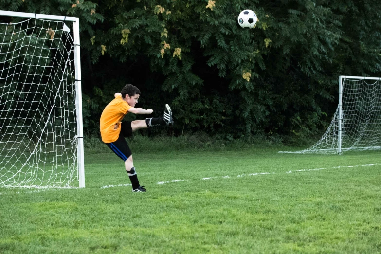 a boy playing soccer is getting ready to make a s