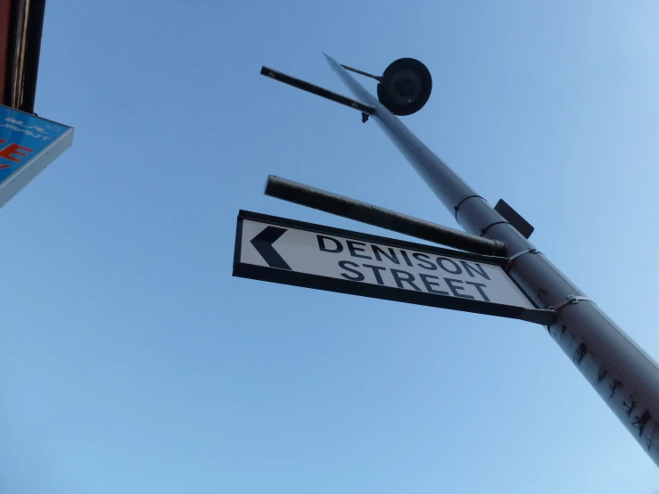 a street sign with two signs on the same pole