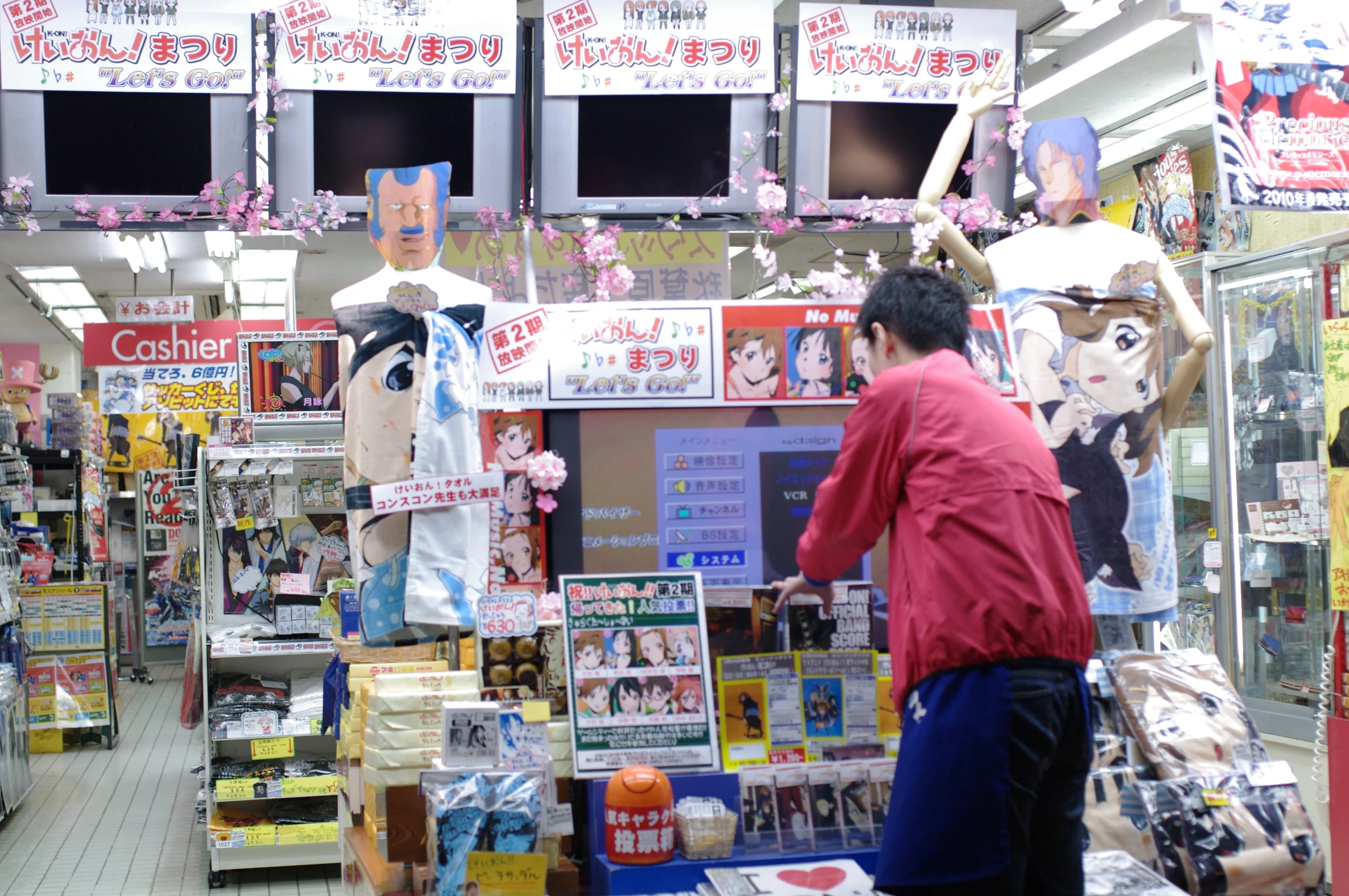 two women shopping in the store with paper figures