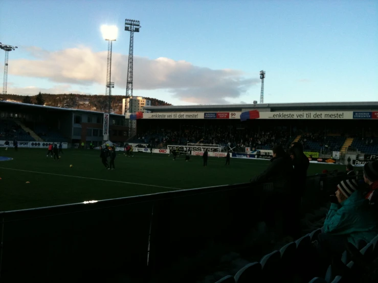 a stadium full of people watching a soccer game