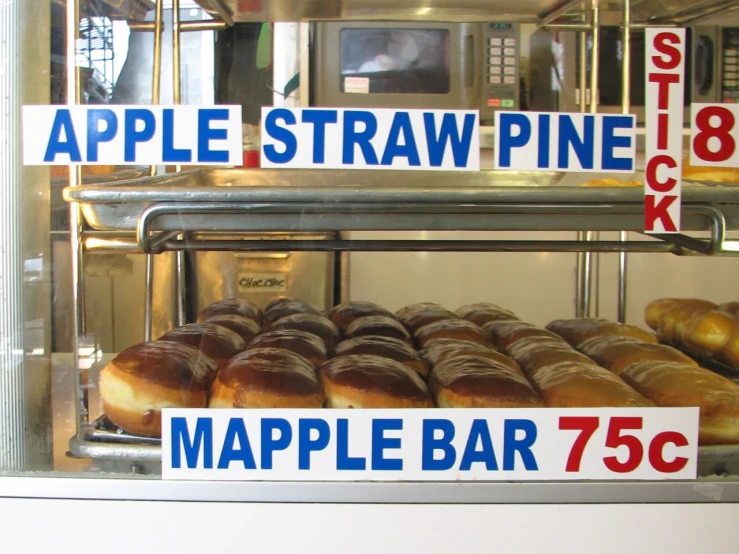 a display case full of donuts and bagels