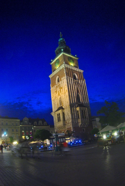 the large clock tower sits in front of the town square