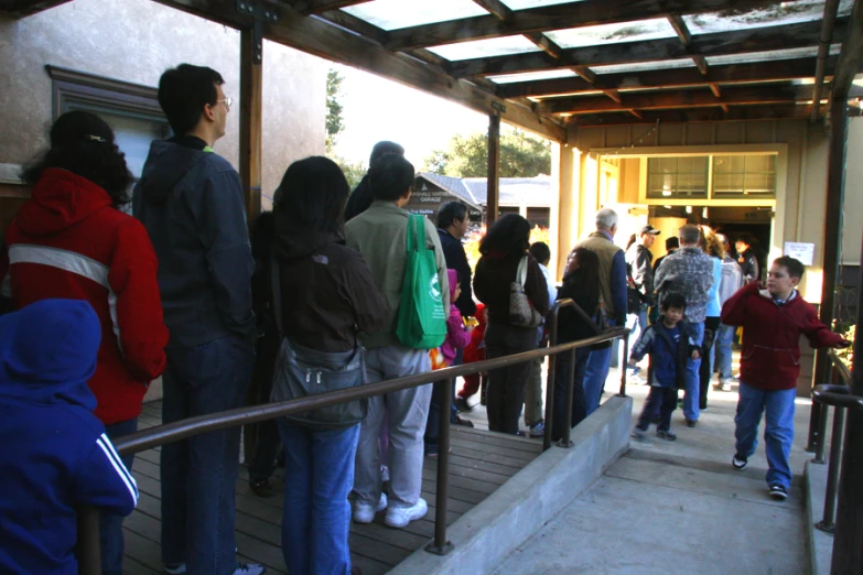 a group of people standing outside of a building