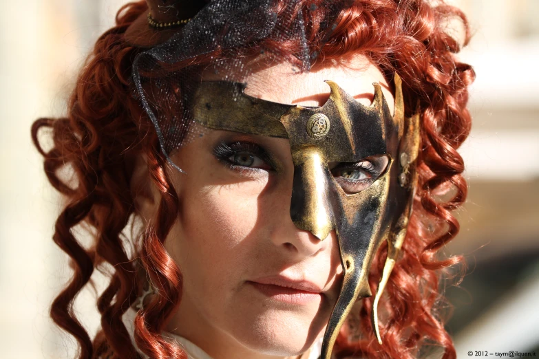 a woman in her face painted like spartan