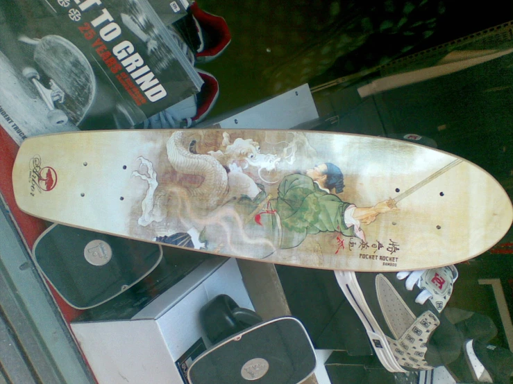 the front end of a snowboard with artwork on it