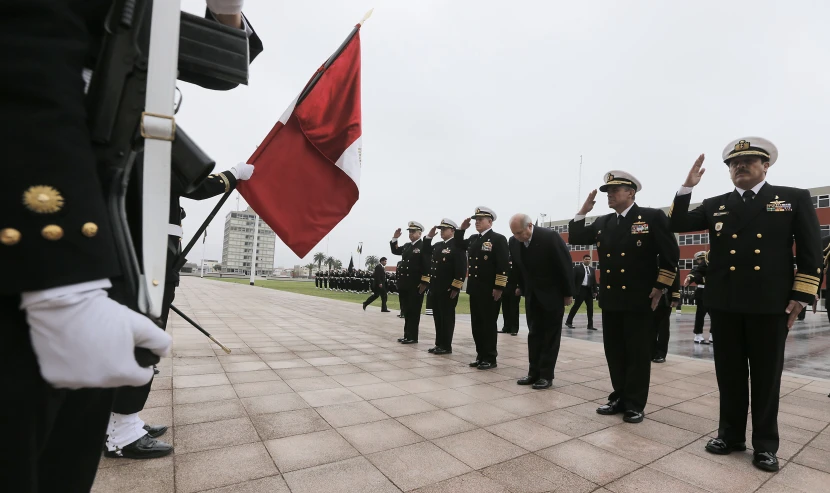 military officers saluting with flags and uniforms on