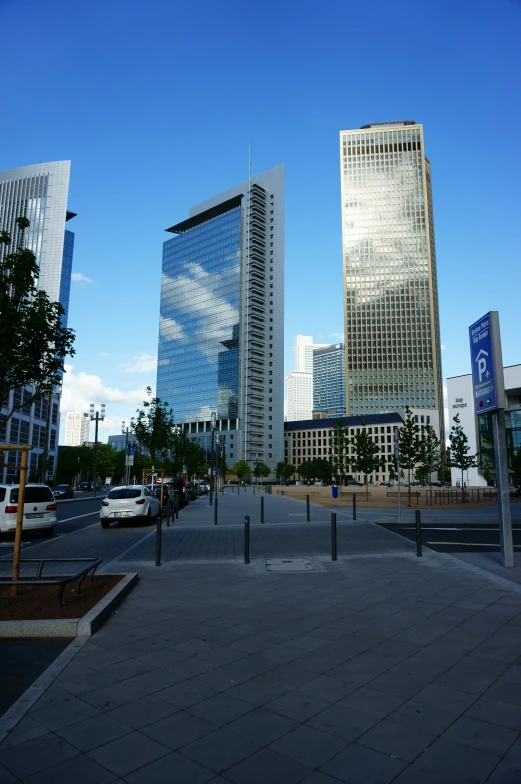 a street in a city with a parking lot